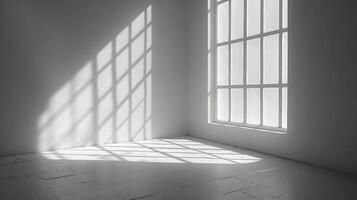 A white room with a window and a light shining through it photo