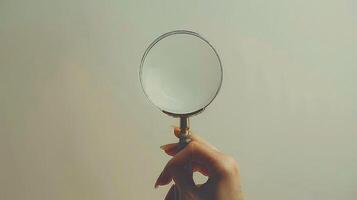 White background hand with magnifying glass. photo