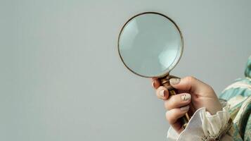 Dynamic exploration hand with magnifying glass. photo
