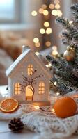 A house with a christmas tree and oranges on a table photo