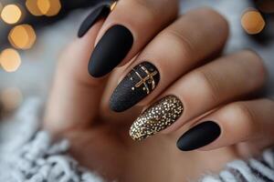 Black matte nails with gold glitter photo