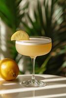 A cocktail with a lemon slice on top photo