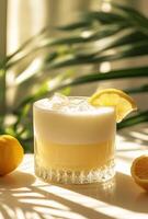A lemonade drink with a slice of lemon on top photo