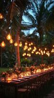 A long table set up with candles and flowers photo