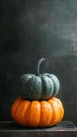 A stack of pumpkins on a wooden table photo