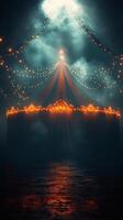A circus tent with lights on it at night photo