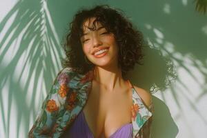 A woman with curly hair and a purple bikini top photo