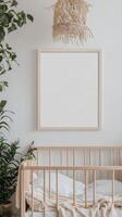 A crib with a blank frame and plants in the corner photo