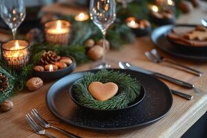 A table setting with a heart shaped cookie and candles photo