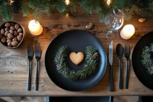A table setting with a heart shaped cookie and a candle photo