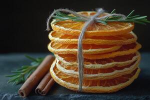 Orange slices with cinnamon and rosemary photo