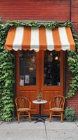 A coffee shop with two chairs and a table photo
