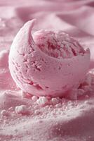 A pink ice cream scoop sitting on top of a pink surface photo
