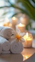 Spa towels and candles on a table photo