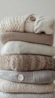 A stack of sweaters on a white background photo