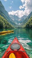 Kayak on the water in a lake surrounded by mountains photo