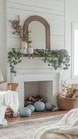 A white fireplace with a mirror and a wreath on it photo