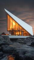 A house on the rocks at sunset photo