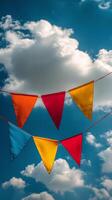 Colorful bunting flags against a blue sky photo