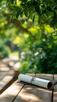 Diploma on wooden table in the park photo