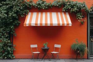 A table and chairs in front of an orange wall photo