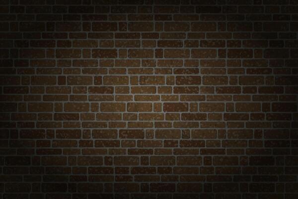 A dark brick wall with a rectangular patterns