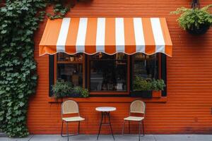A table and chairs in front of a building photo