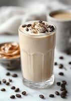 Coffee and peanut butter milkshake with a cup of coffee beans photo
