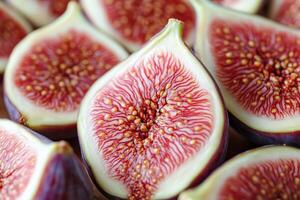 Figs are cut into halves and are arranged in a pile photo