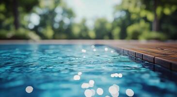 A pool with water and a wooden deck photo