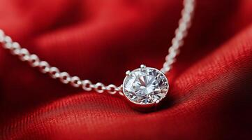 A diamond pendant on a red cloth photo