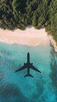 Airplane flying over tropical beach photo