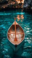 A boat floating in the water with a paddle photo