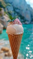 A cone with ice cream and mint leaves on it photo