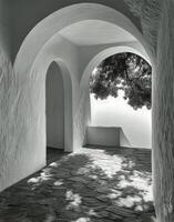A black and white photo of an archway