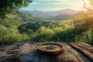 A compass on a wooden table in the forest with a view of the mountains photo