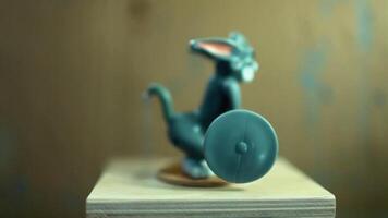 fitness with barbell in hands, toy automaton, close-up, shallow depth of field video