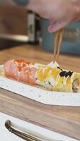 Adding Fresh Ginger to Sushi Rolls Close-Up Culinary Preparation video