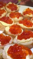 Close up view of tartlet with caviar at plate on the table. video