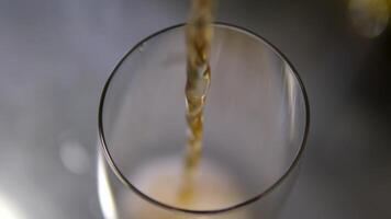 Cola pour a drink into a glass sparkling water flows in a stream into a glass goblet video