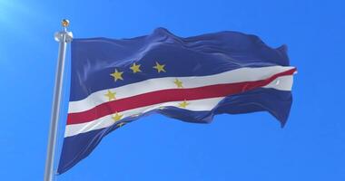 Flag of Cape Verde waving at wind in slow with blue sky, loop video
