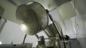 Production of potato chips and snacks. Chips are fried in a large bowl with butter 2 video