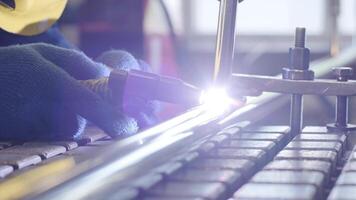 Closeup of man wearing mask welding in a workshop. Metal workers use manual labor. Skilled welder. Welder is welding the stainless steel pipes in the factory. welder Industrial part in factory. video