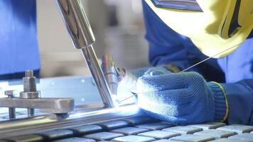Man wearing mask welding in a workshop. Metal workers use manual labor. Skilled welder. Welder is welding the stainless steel pipes in the factory. welder Industrial part in factory. 5 video