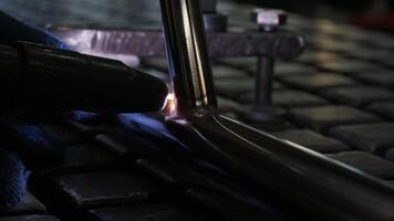Man is welding in a workshop. Metal workers use manual labor. Skilled welder. Welder is welding the stainless steel pipes in the factory. welder Industrial part in factory. video