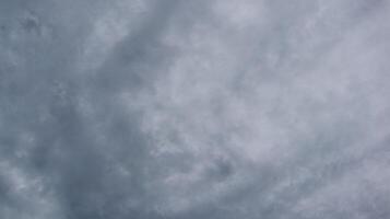 Deep gray clouds with abstract pattern during rainy season photo
