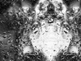 Blurred Monochrome Window with Rain Drops abstract background photo