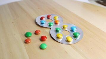 Eyeglass Candies on a Wooden Table photo