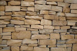 Sandstone Wall with Textured Old Bricks and Light Brick Surface Pattern photo