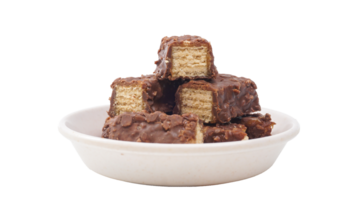 Chocolate coated wafer bars stacked with caramel filling and crisp layers isolated on transparent background png